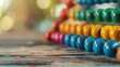Colorful abacus beads on wooden table with blurred background