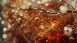 Cola with ice. Fizzy cola water with bubbles in a glass. Cola soda ice floating on top of the surface. Background of a cold drink.