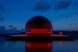 © Marcos Osorio/Stocksy - Modern architecture in the middle of a lake at twilight
