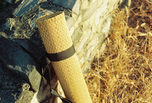 A Roll Of Straw Mat Placed On The Wild Great Wall
