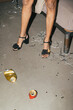 © Basil Pind/Stocksy - Disarray and Elegance: High Heels Amidst Party Aftermath