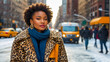Beautiful stylish African American girl on a city street in winter