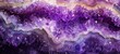 Vibrant purple amethyst geode rock, sparkling and lustrous crystals inside with striking textures and natural patterns