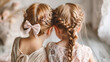 Two little girls sisters with braids in white dresses close-up