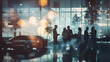 Silhouette of corporate executives standing in modern office lobby having discussions, with backdrop of cars in the drive way