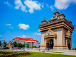 Patuxai Victory Monument in Vientiane Laos - Prime Minister office in the back - Blue Sky Sunny day