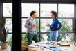 © ALTO IMAGES/Stocksy - Cheerful diverse coworkers chatting in office