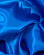 © Rebecca Peloquin/Stocksy - Ruffled Blue Satin Fabric shapes