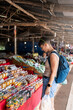 © Alvaro Lavin/Stocksy - Female tourist at Thai food market.