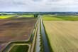 Aerial view of wide open farm lands and canals in the Netherlands
