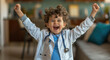 A cute child wearing a doctor's coat and stethoscope, with his arms raised in joyous celebration of life