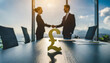 £ symbol, on an empty office table. In the blurry backdrop two people shake hands. Business agreement concept