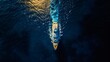 Aerial photo of a large luxury yacht isolated in the middle of a deep blue ocean.