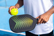 Unrecognizable close-up sportive man with pickleball equipment