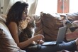 Student girl teen with laptop clutching cat on sofa and relaxing. Generative Ai