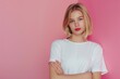 Cute young woman blonde hair with bob haircut pink background
