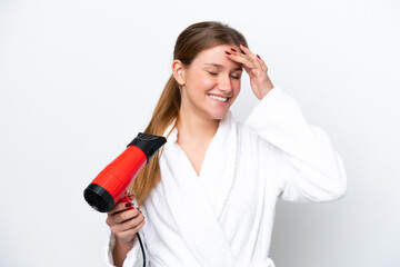 Wall Mural - Young caucasian woman holding hairdryer isolated on white background has realized something and intending the solution