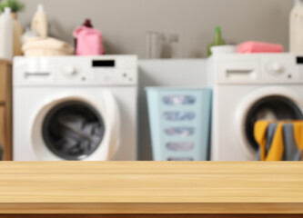 Wall Mural - Wood table for display products on blurred laundry room