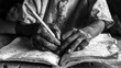 A touching image in monochrome showing a child moving from labor to learning, with calloused hands now grasping a book and pencil on World Day Against Child Labour