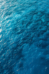 Wall Mural - sea surface. aerial view of blue clean sea. vertical summer background. copy space.