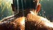   A man's back submerged in water, sun casting long shadows behind