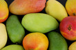 Different colorful mango fruits as background	
