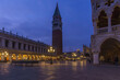 An empty illuminated San Marco square with the bell tower and Doge Palace at blue hour on a winter evening, Venice, Veneto, Italy