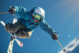 Fototapeta  - Male freestyle skier flying in the air