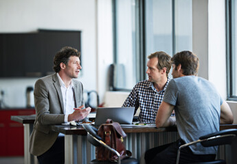 Poster - Business men, plan and laptop in office for startup collaboration, online company and web design. Professional team, conversation and working on project for internet strategy, meet and tech update