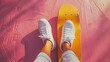 Vivid pink backdrop with yellow skateboard and casual white sneakers