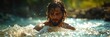 A man with dreadlocks immersed in the water during baptism ceremony conducted by Jesus.