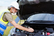 © DG PhotoStock - Auto technician analyze a problem in vehicle.
