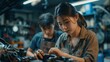 After fixing the car engine problem, Asian women get the contact information of Asian male auto mechanics and use QR codes to pay for vehicle repair. Car repair service concept.