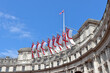 White Ensign flags flying on Admiralty Arch which connects The Mall and Trafalgar Square in London