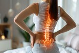 Fototapeta Na sufit - Woman experiencing back discomfort at home due to lumbar intervertebral spine hernia. Generative Ai