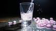 An aspirin tablet is dissolved in a glass of water.