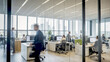 © Thomas Kühnlein - Office with working people behind blurred glass wall