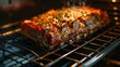 Succulent roasted meatloaf garnished with herbs on a grill in an oven