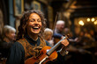 A woman is smiling and holding a violin