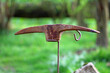 old rusty iron pickaxe in the garden