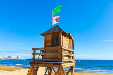 Wall Mural - Lifeguard tower on beach in a beautiful summer day. Playa del Medano in Tenerife, Canary Islands