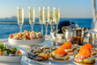 A luxury brunch set up on a yacht, with a table showcasing gourmet foods like lobster eggs benedict, caviar on blinis,