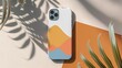 Top view of smartphone with colorful case on colorful background with palm leaves and shadows top view. Mock up 