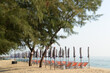 Beach deck chairs and umbrella in the morning at Cha-am Beach.  Located at Phetchaburi Province in Thailand.