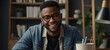 Headshot portrait of happy african American man in glasses sit at desk have video call on gadget, smiling biracial young male in spectacles talk speak on web, using online dating service application