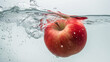 Apple submerged in water on white background 
