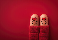 Finger Drawing Of Two Fingers With Smiling Faces And A Heart On A Red Background, With Copy Space For Text