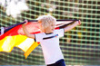© famveldman - Germany football fan kids. Children play soccer.