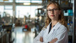 © Oleksandr - A young scientist with glasses and a lab coat stands against a laboratory background
