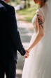 The image features a man and woman holding hands 6946.